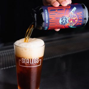 Can of Redrum Red IIPA pouring into glass