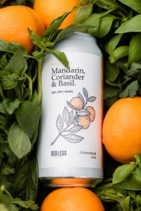 Mandarin, Coriander & Basil Berliner Weisse surrounded by fresh produce